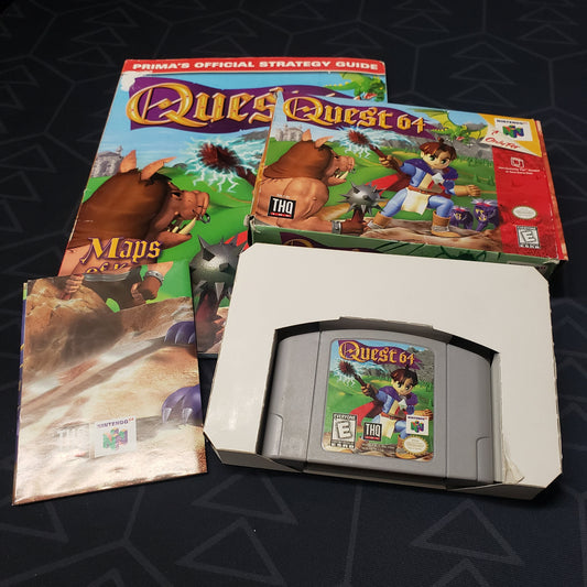 Image shows the cartridge, box and posrt for the video game Quest 64 sitting on top of the game's strategy guide