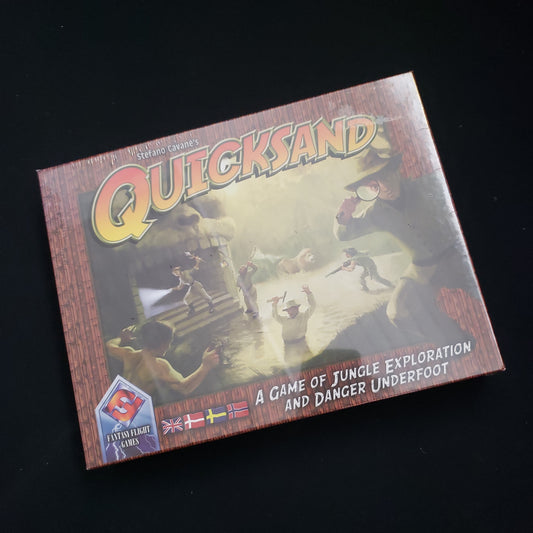 Image shows the front cover of the box of the Quicksand board game