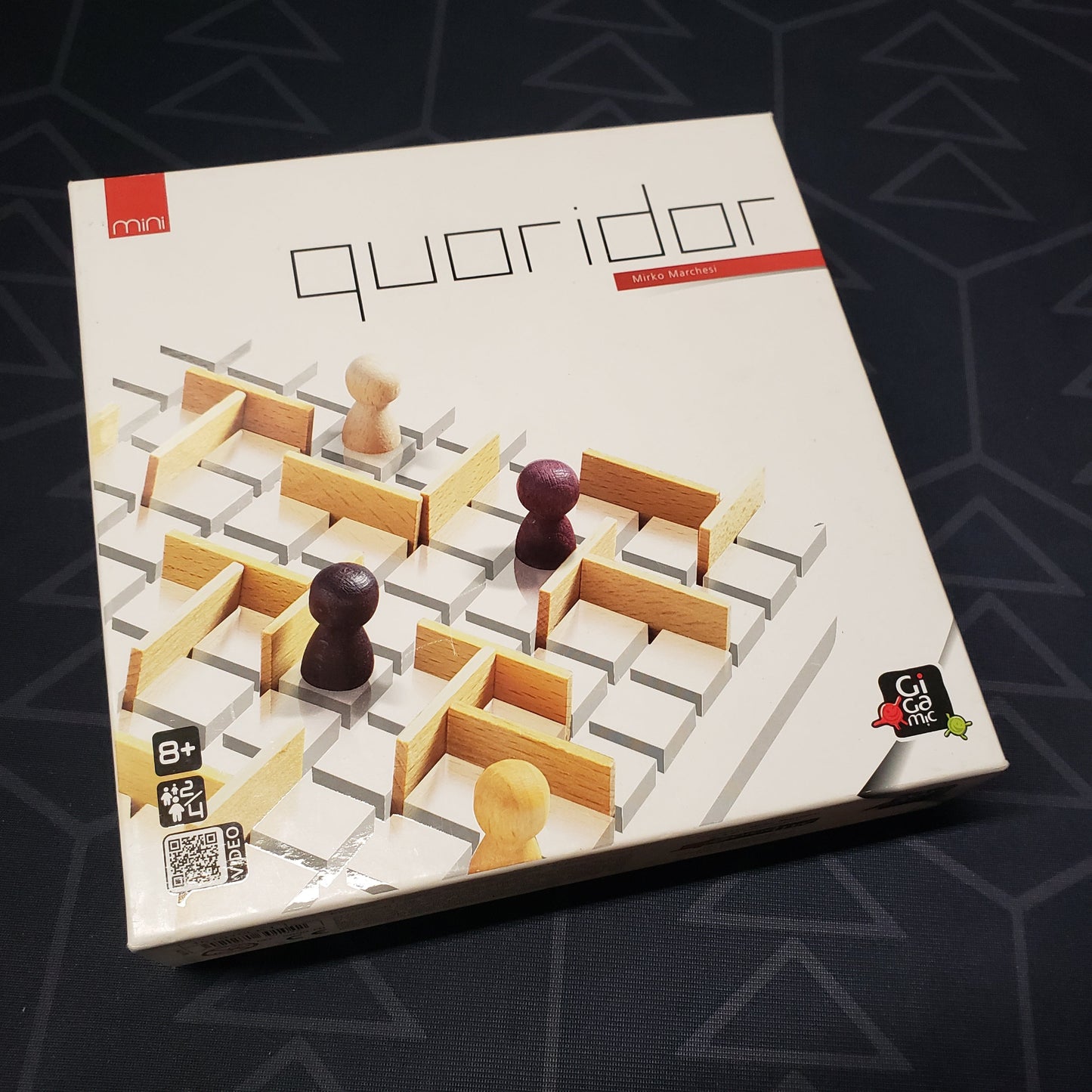 Image shows the front cover of the box for the Quoridor Mini board game