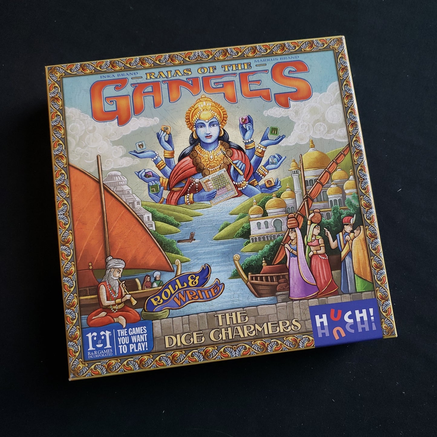 Image shows the front cover of the box of the Rajas of the Ganges: The Dice Charmers board game