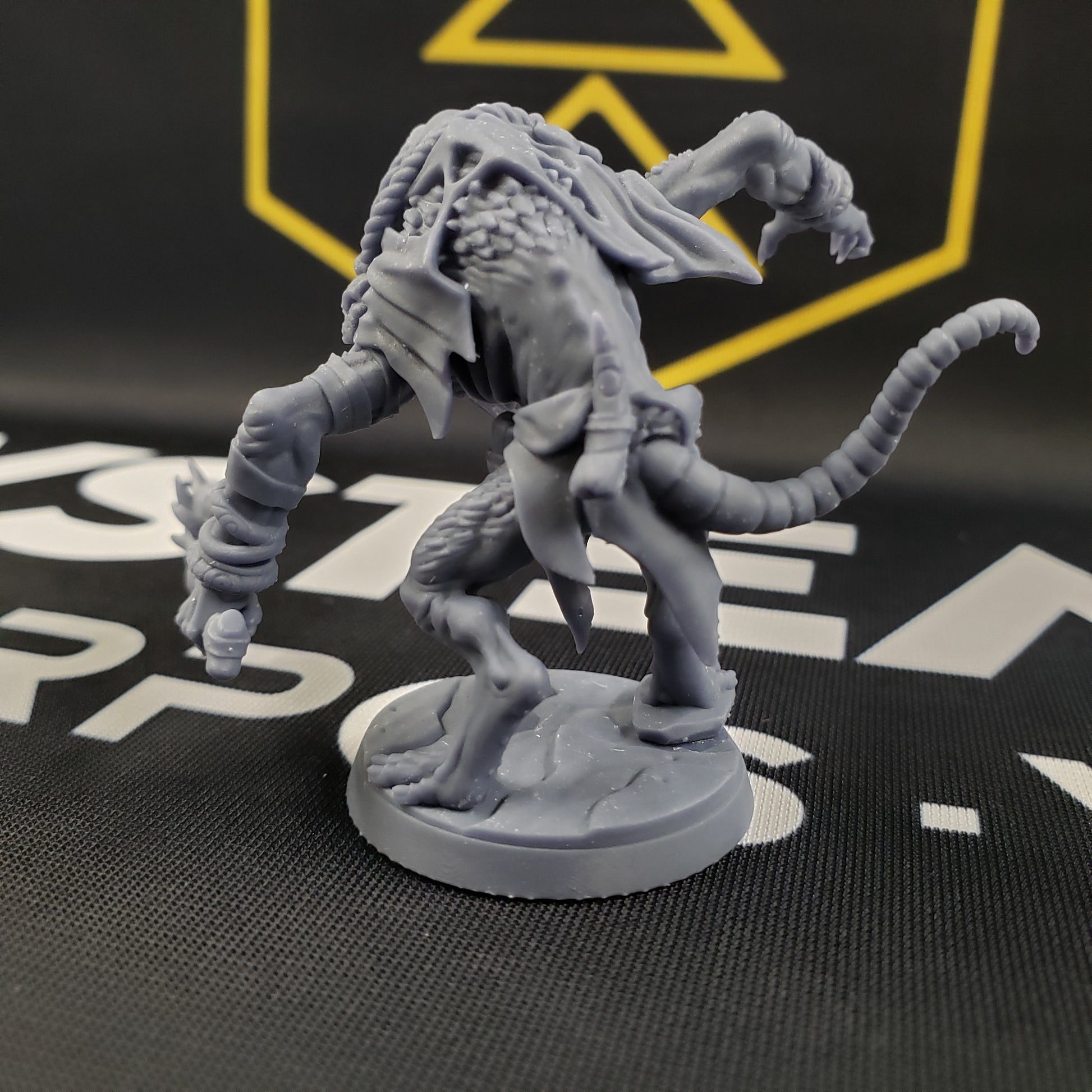 Image shows the back of a 3D printed gaming miniature of a rat warrior