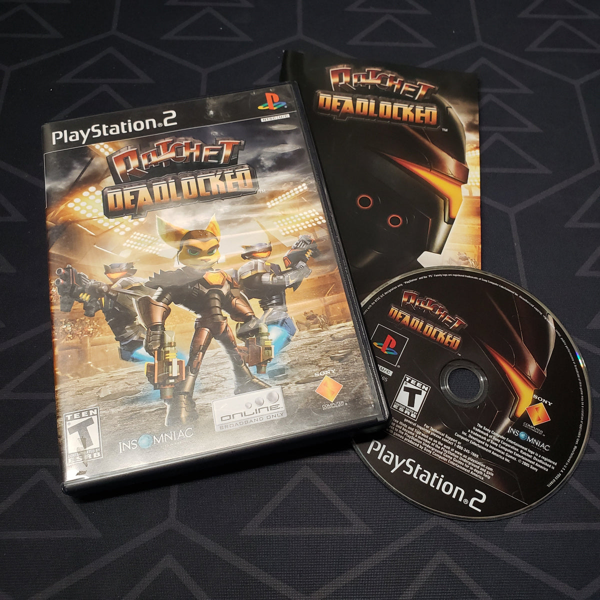 Image shows the case, manual and disc for the video game Ratchet: Deadlocked for Playstation 2