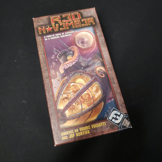 Image shows the front cover of the box of the Red November board game