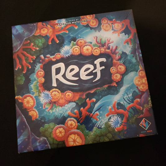 Image shows the front cover of the box of the Reef board game
