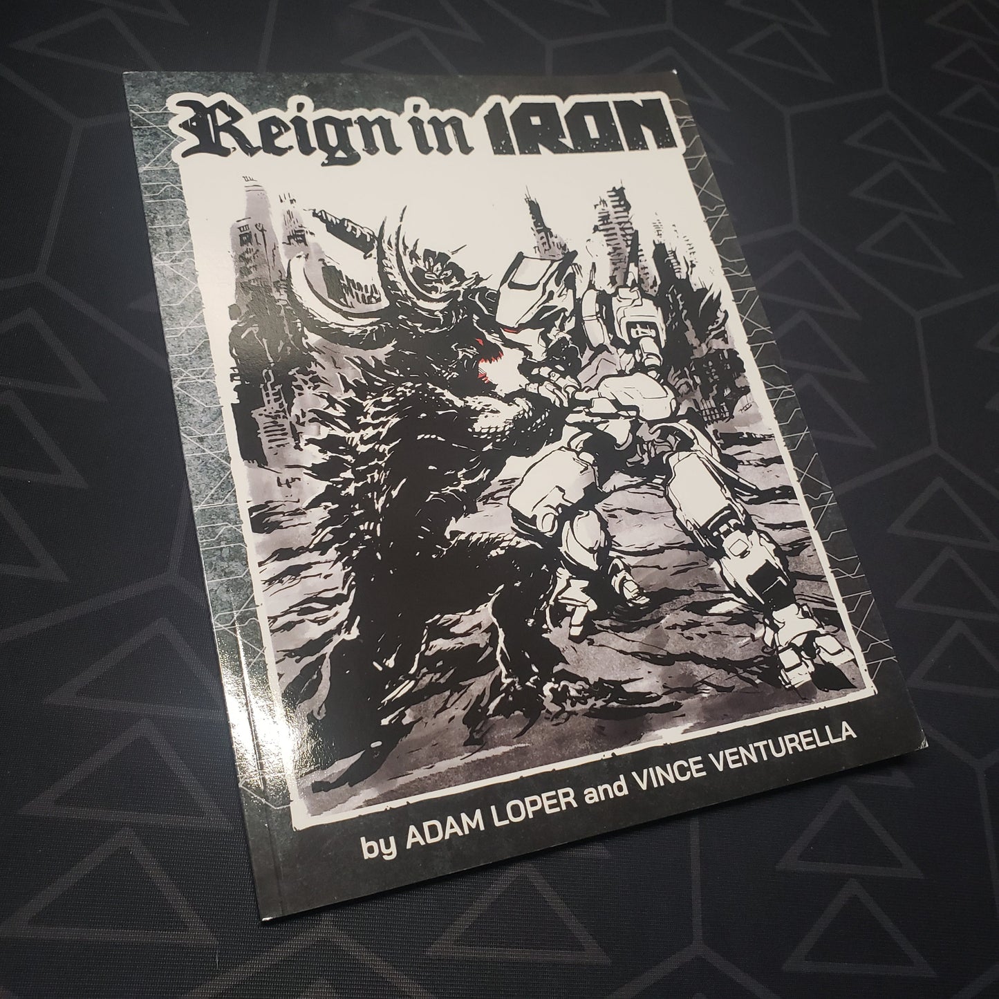 Image shows the front cover of the Reign in Iron wargaming book