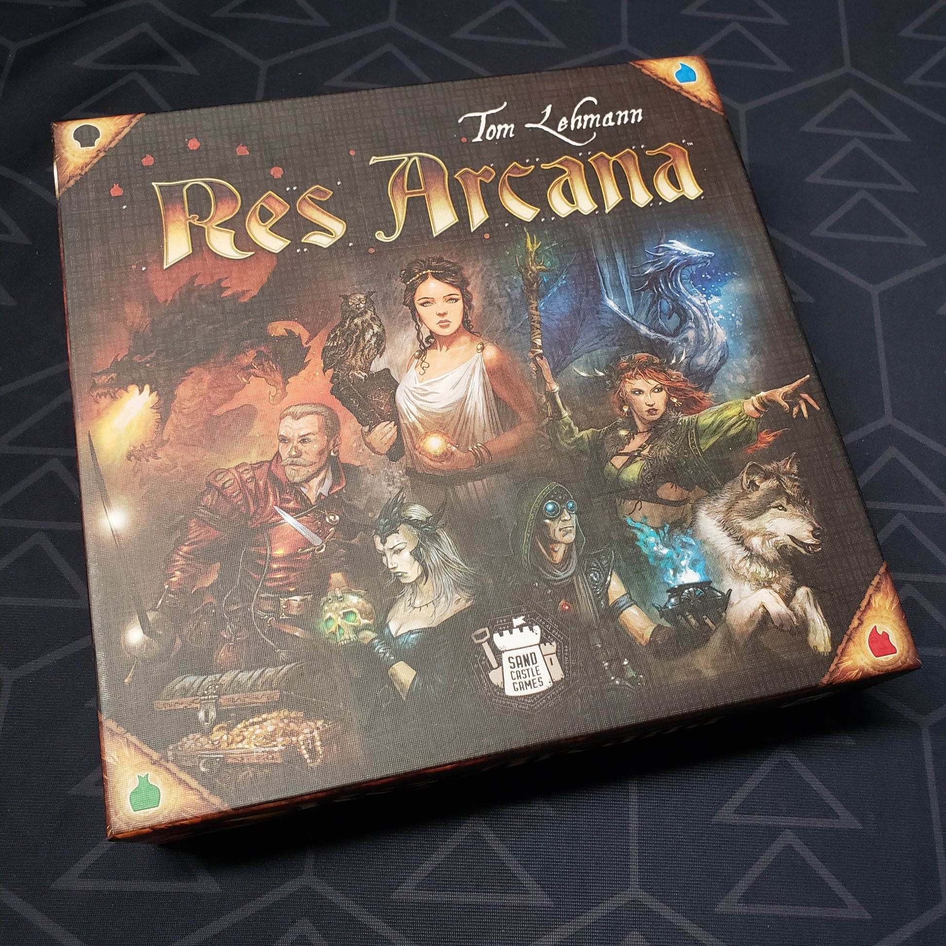 Image shows the front cover of the box for the Res Arcana card game