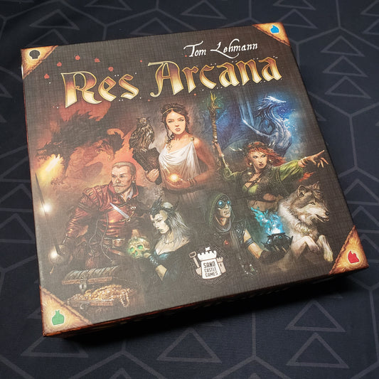 Image shows the front cover of the box for the Res Arcana card game