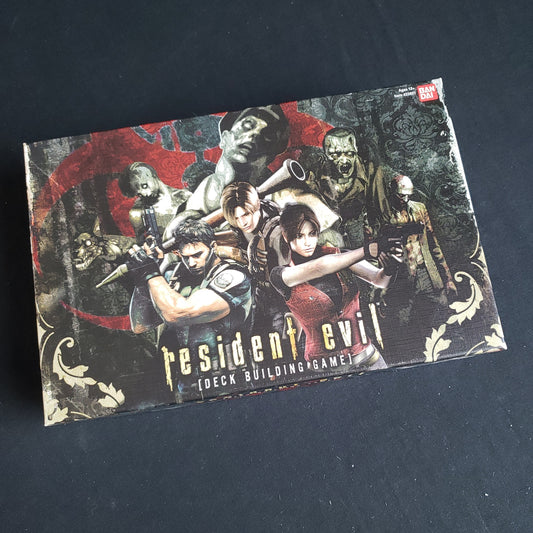 Image shows the front cover of the box of the Resident Evil Deckbuilding game