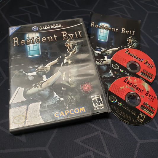 Image shows the case, manual and two discs for the video game Resident Evil for Nintendo GameCube