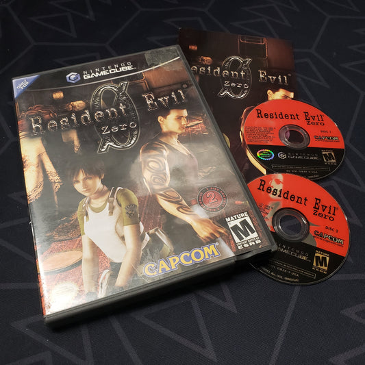 Image shows the case, manual and two discs for the video game Resident Evil Zero  for Nintendo GameCube
