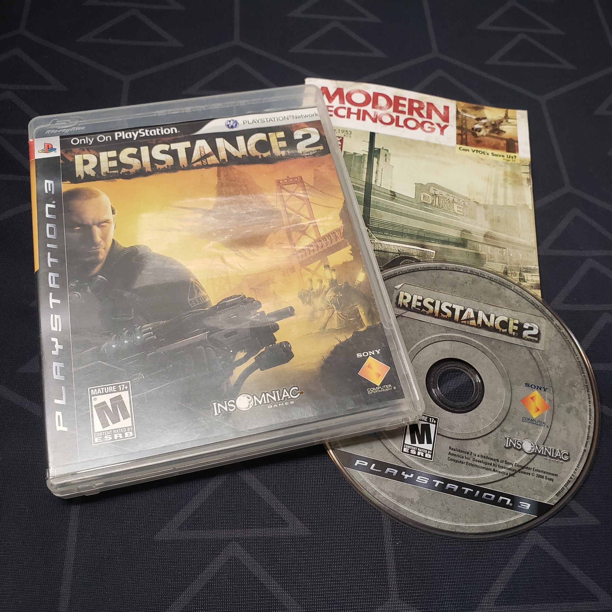 Image shows the case, manual and disc for the video game Resistance 2 for Playstation 3