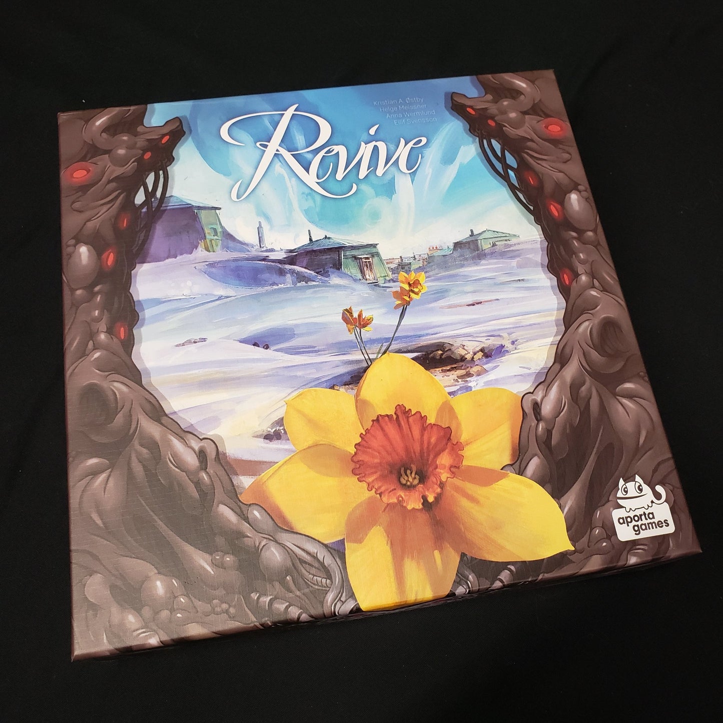 Image shows the front cover of the box of the Revive board game