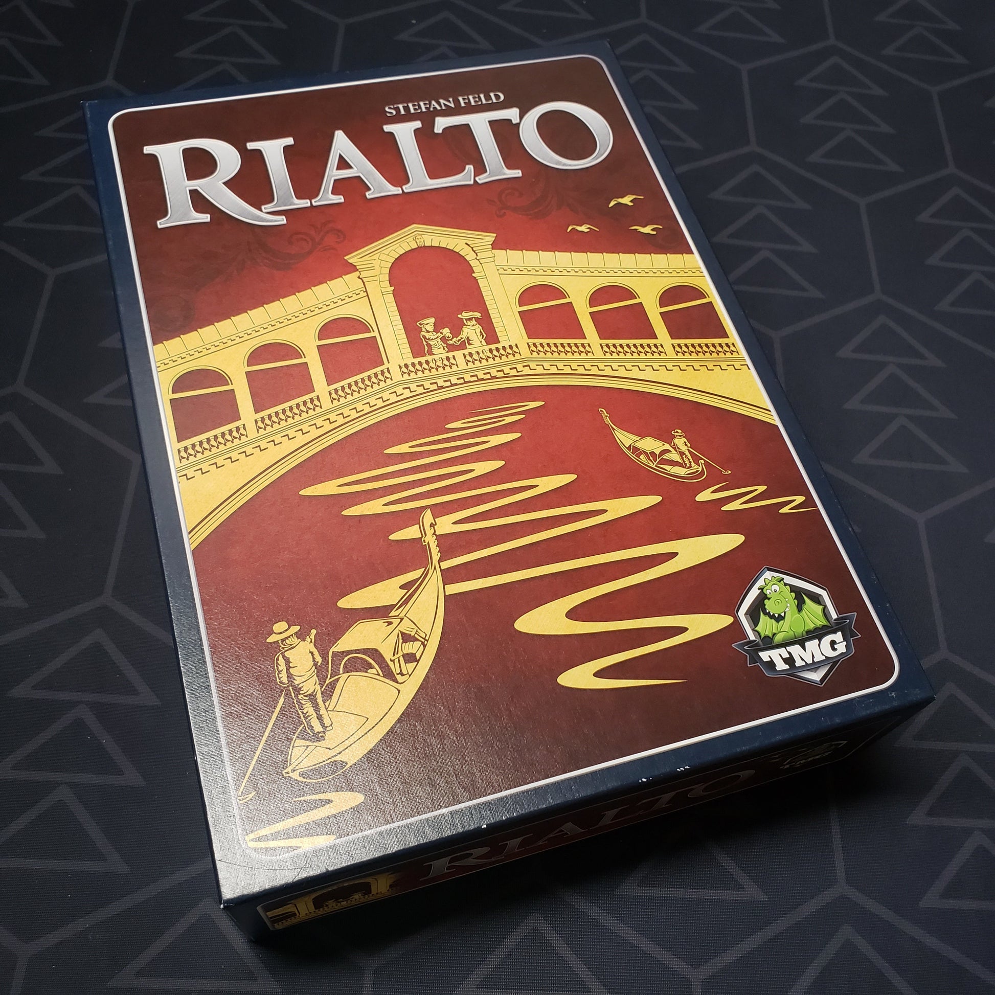Image shows the front cover of the box for the Rialto board game