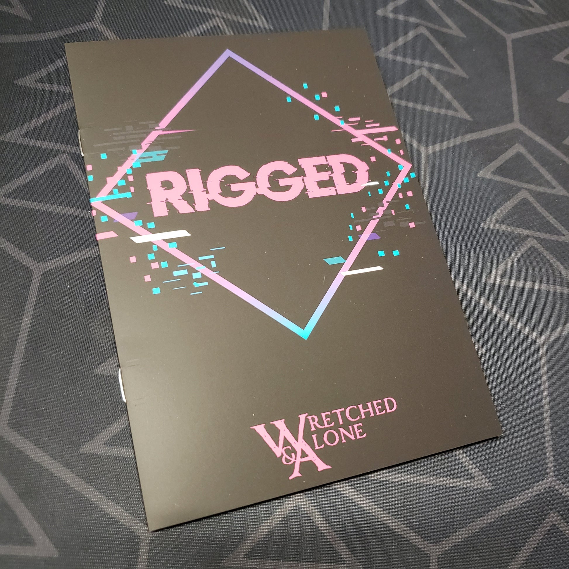 Image shows the front cover of the Rigged roleplaying game zine
