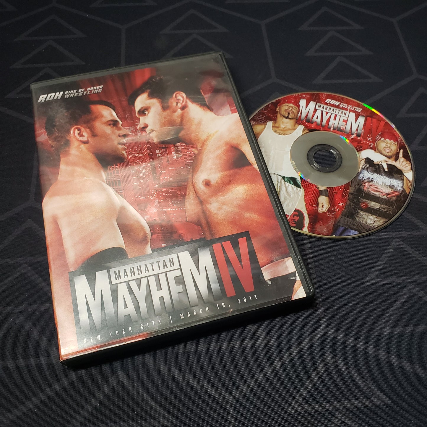 Image shows the case & disc for the 03/19/2011 pro wrestling event Ring of Honor: Manhattan Mayhem IV on DVD
