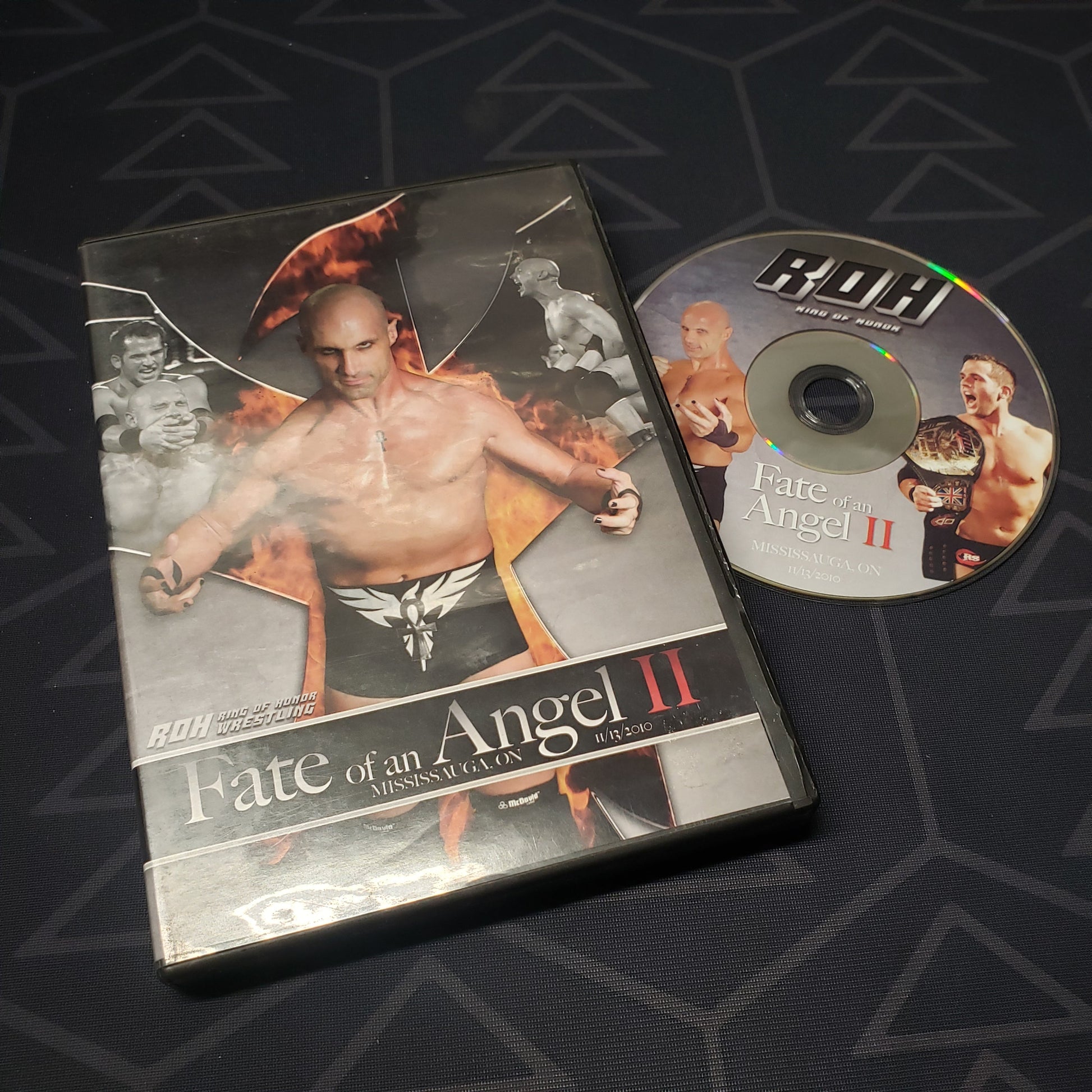 Image shows the case & disc for the 11/13/2010 pro wrestling event Ring of Honor: Fate of an Angel II on DVD