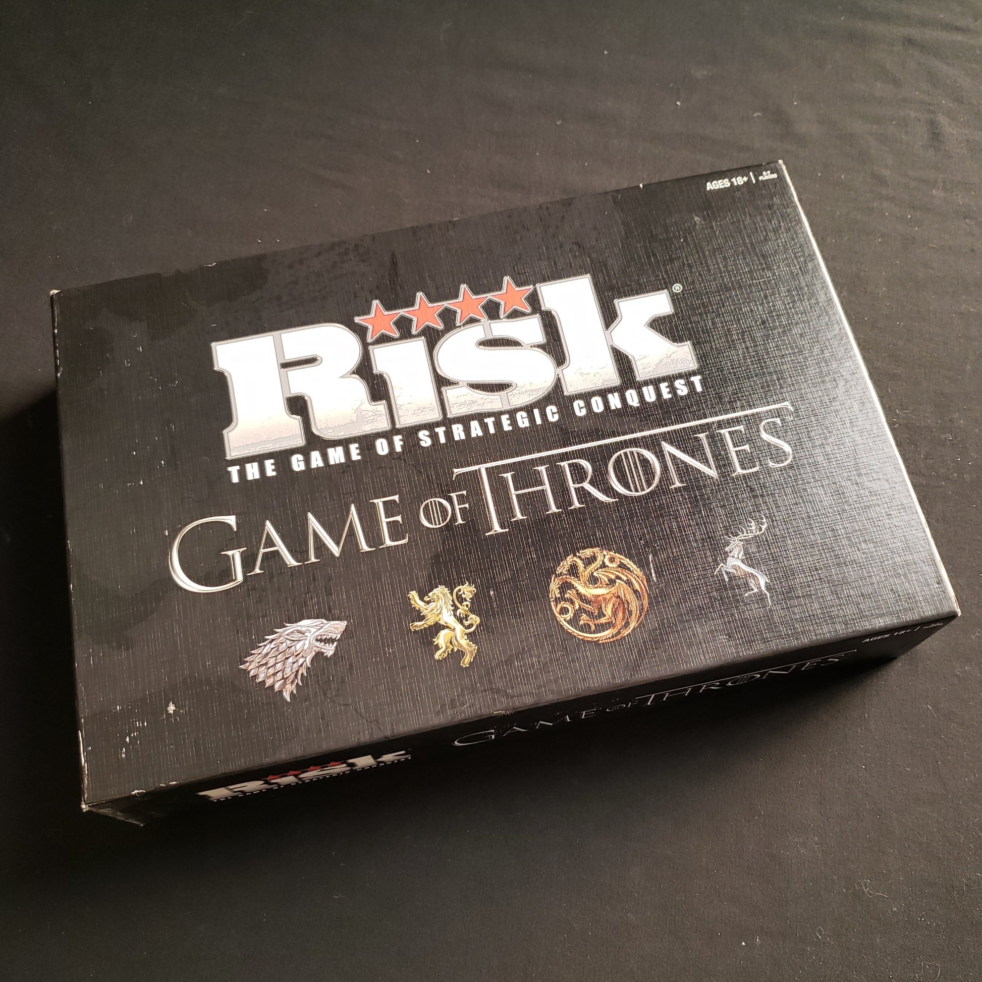 Image shows the front cover of the box of the Risk: Game of Thrones board game