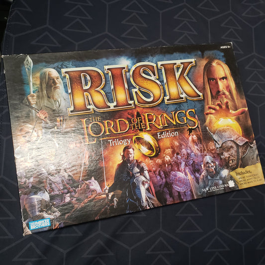 Image shows the front cover of the box for the Risk: Lord of the Rings Trilogy Edition board game