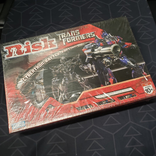 Image shows the front cover of the box for the Risk: Transformers - Cybertron Battle Edition board game