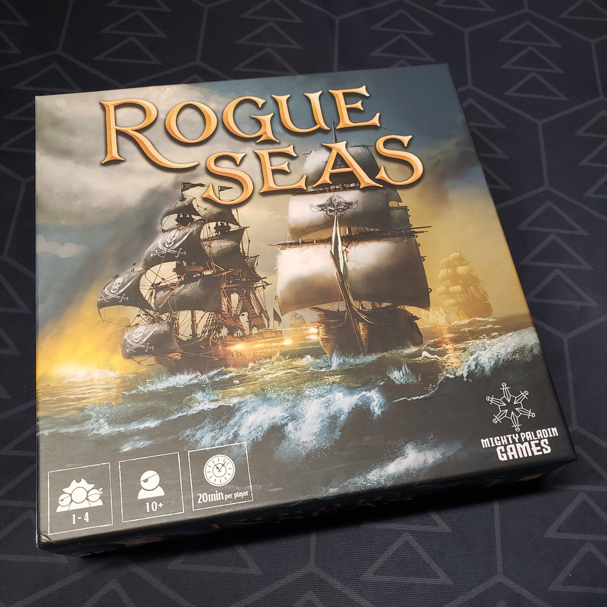 Image shows the front cover of the box for the Rogue Seas board game