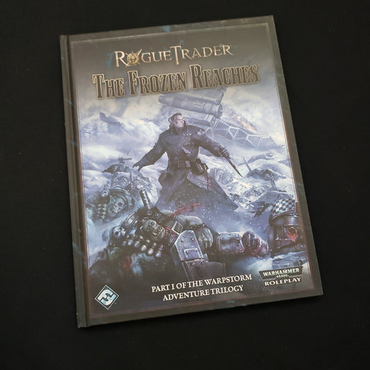 Image shows the front cover of the Frozen Reaches book for the Rogue Trader roleplaying game