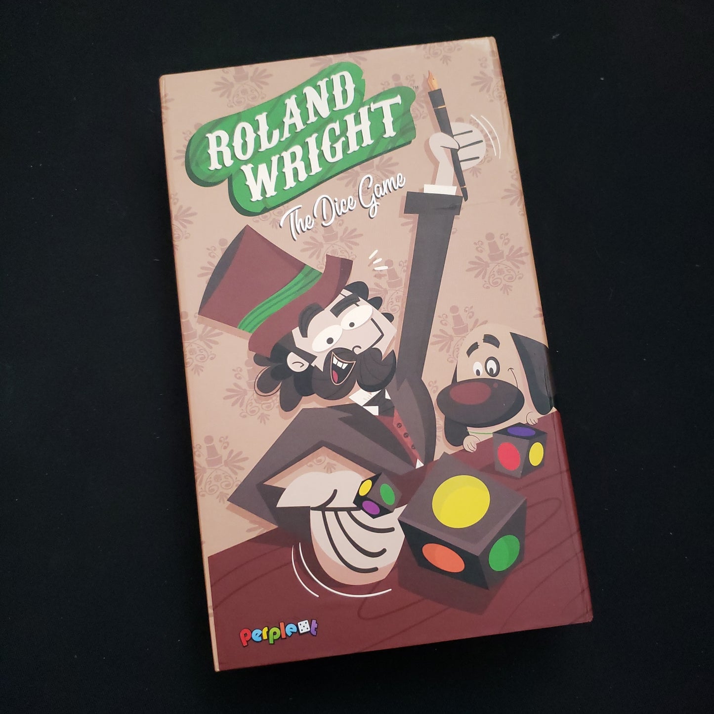 Image shows the front cover of the box of Roland Wright: The Dice Game