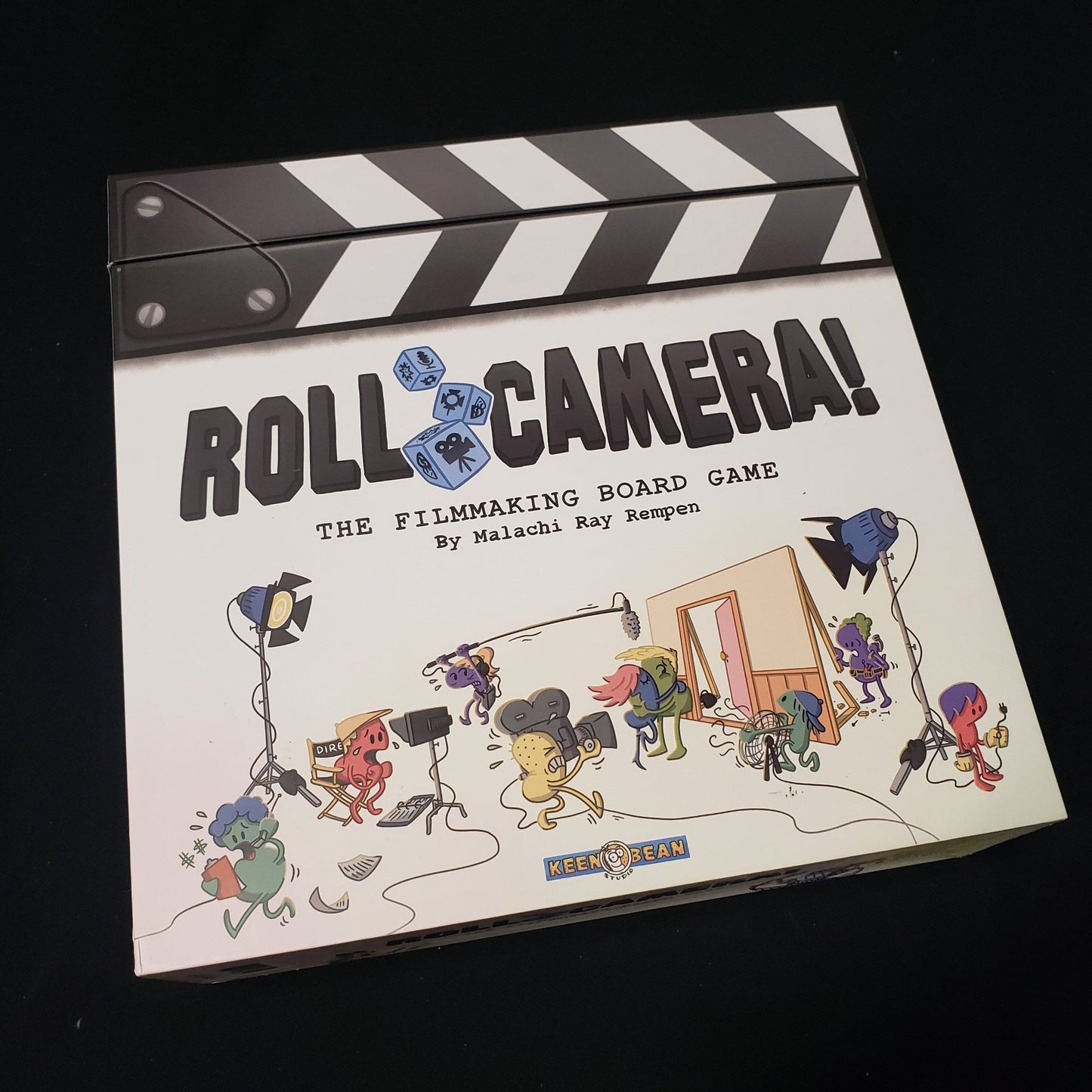 Image shows the front cover of the box of the Roll Camera! board game