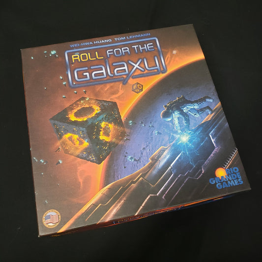 Image shows the front cover of the box of the Roll for the Galaxy board game