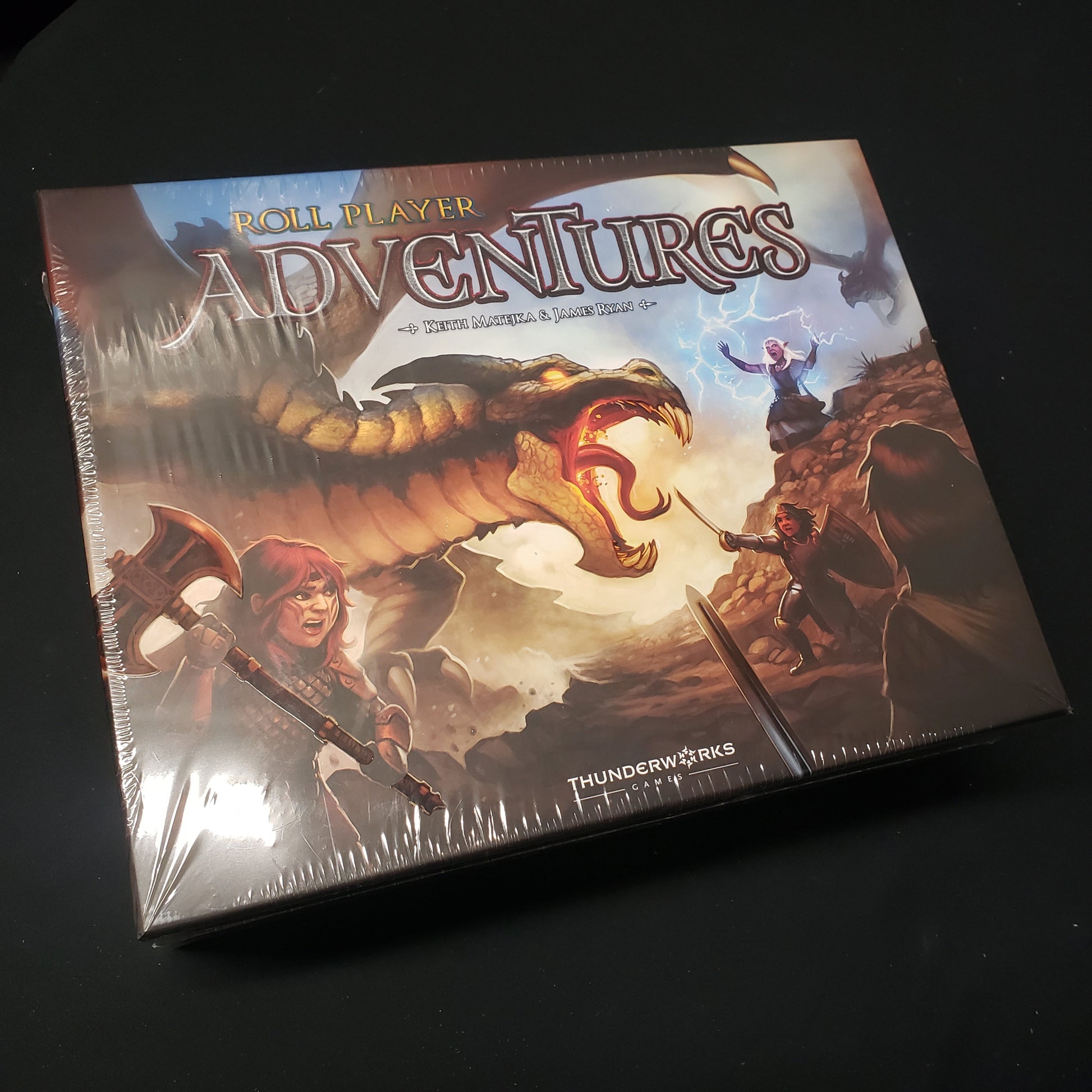 Image shows the front cover of the box for the Roll Player Adventures board game