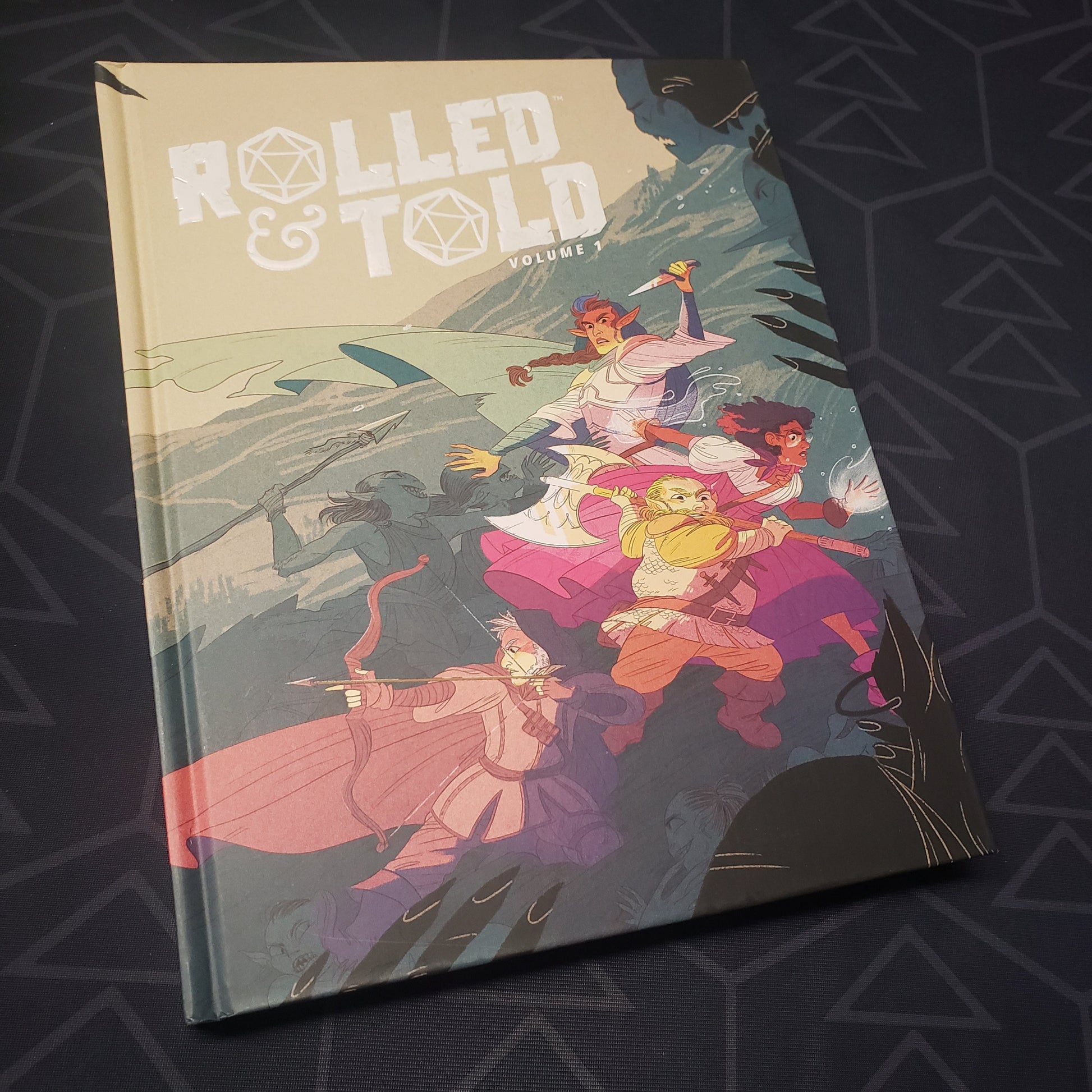Image shows the front cover of the Rolled & Told: Volume 1 roleplaying game book