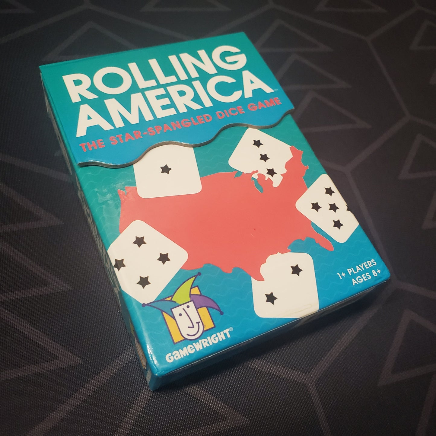 Image shows the front cover of the box for the Rolling America board game