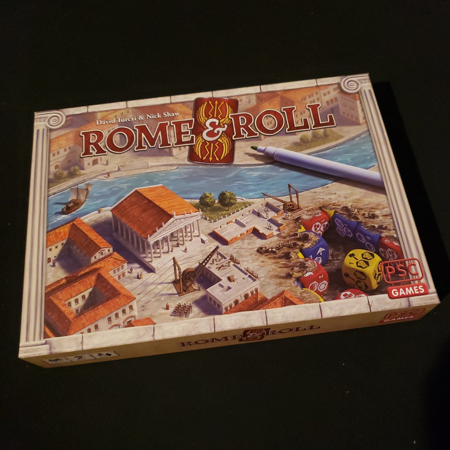 Image shows the front cover of the box of the Rome & Roll board game
