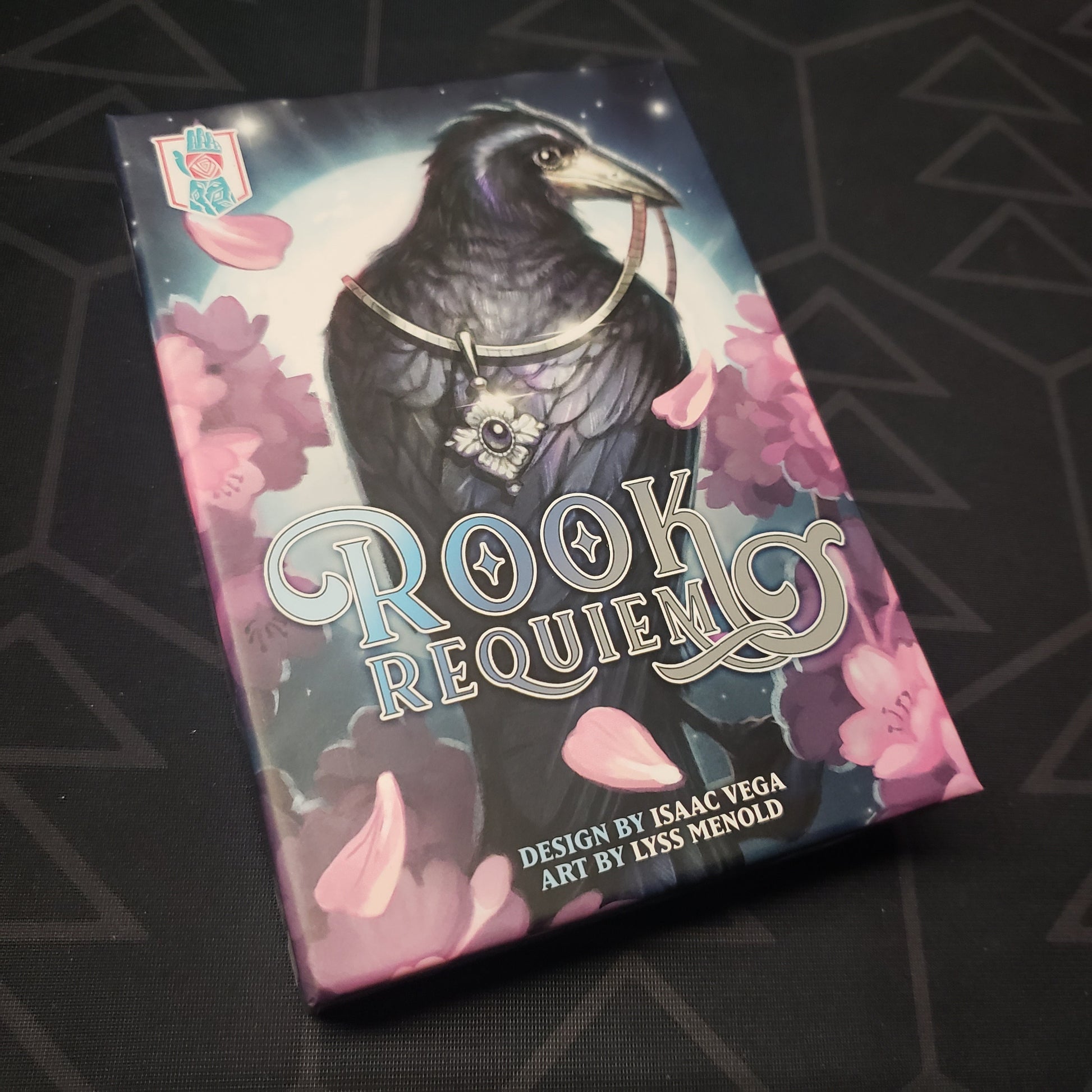 Image shows the front cover of the box for the Rook Requiem card game