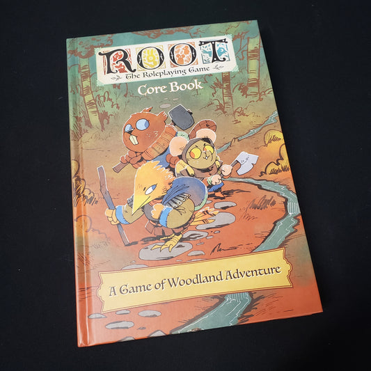 Image shows the front cover of the core rulebook for the Root roleplaying game