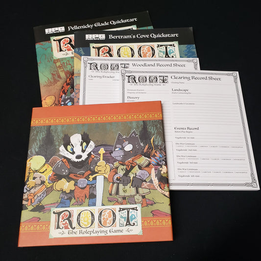 Image shows a GM screen, character pads, and quickstart guides for theroleplaying game Root