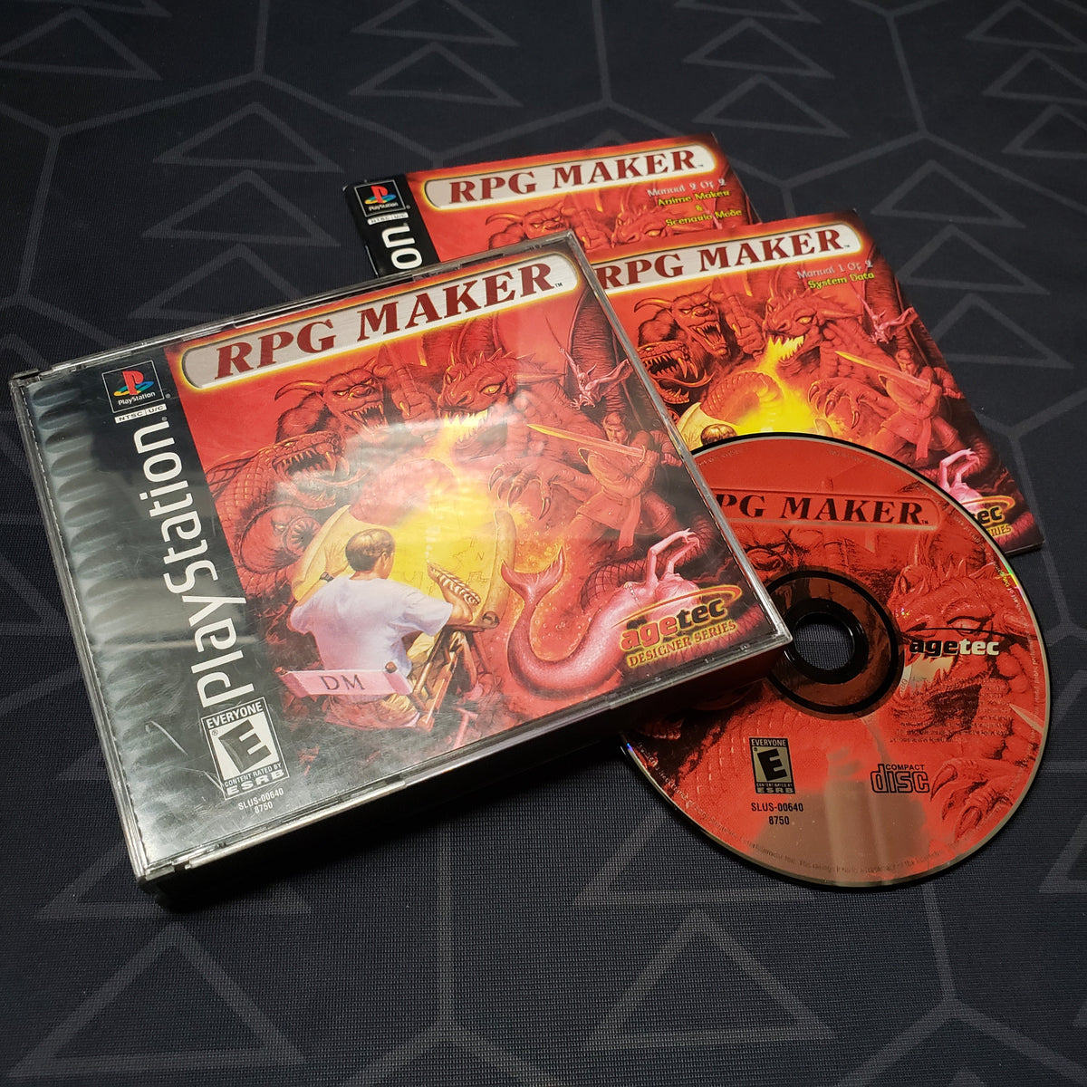 Image shows the jewel case with two manuals and game disc for the video game RPG Maker for Playstation 1
