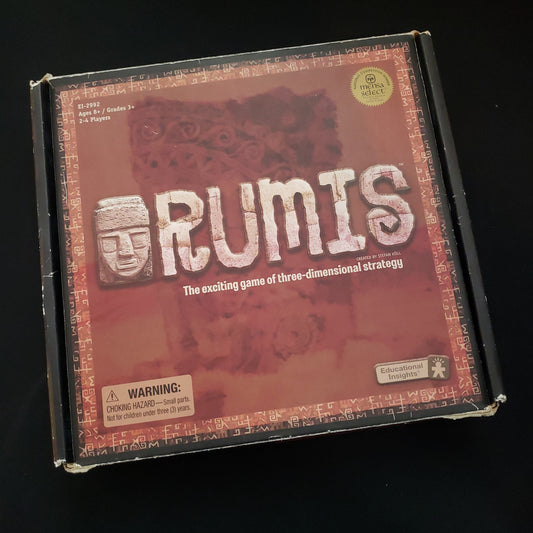 Image shows the front cover of the box of the Rumis board game