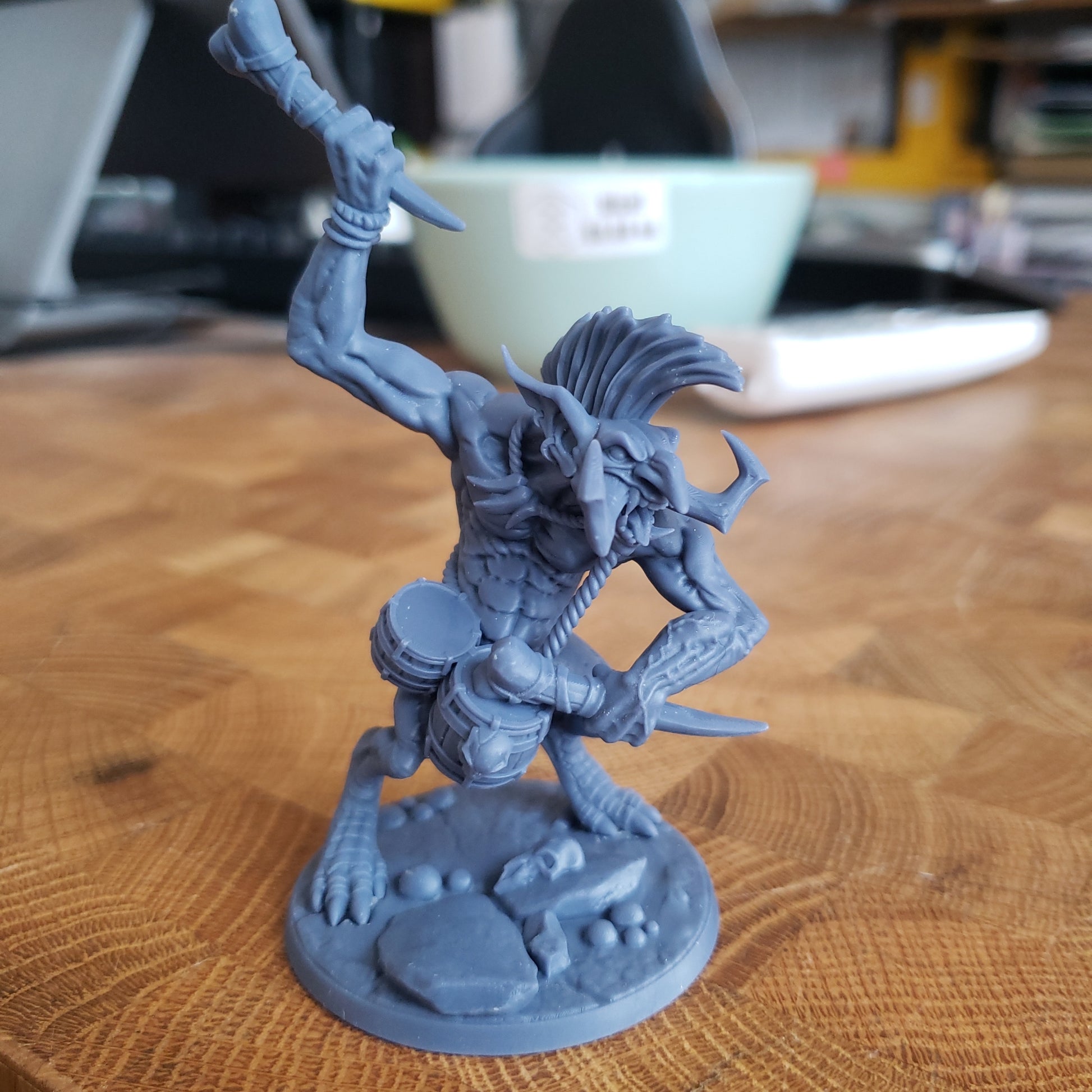 Image shows an example of a 3D printed troll drummer miniature printed in-house at All Systems Go