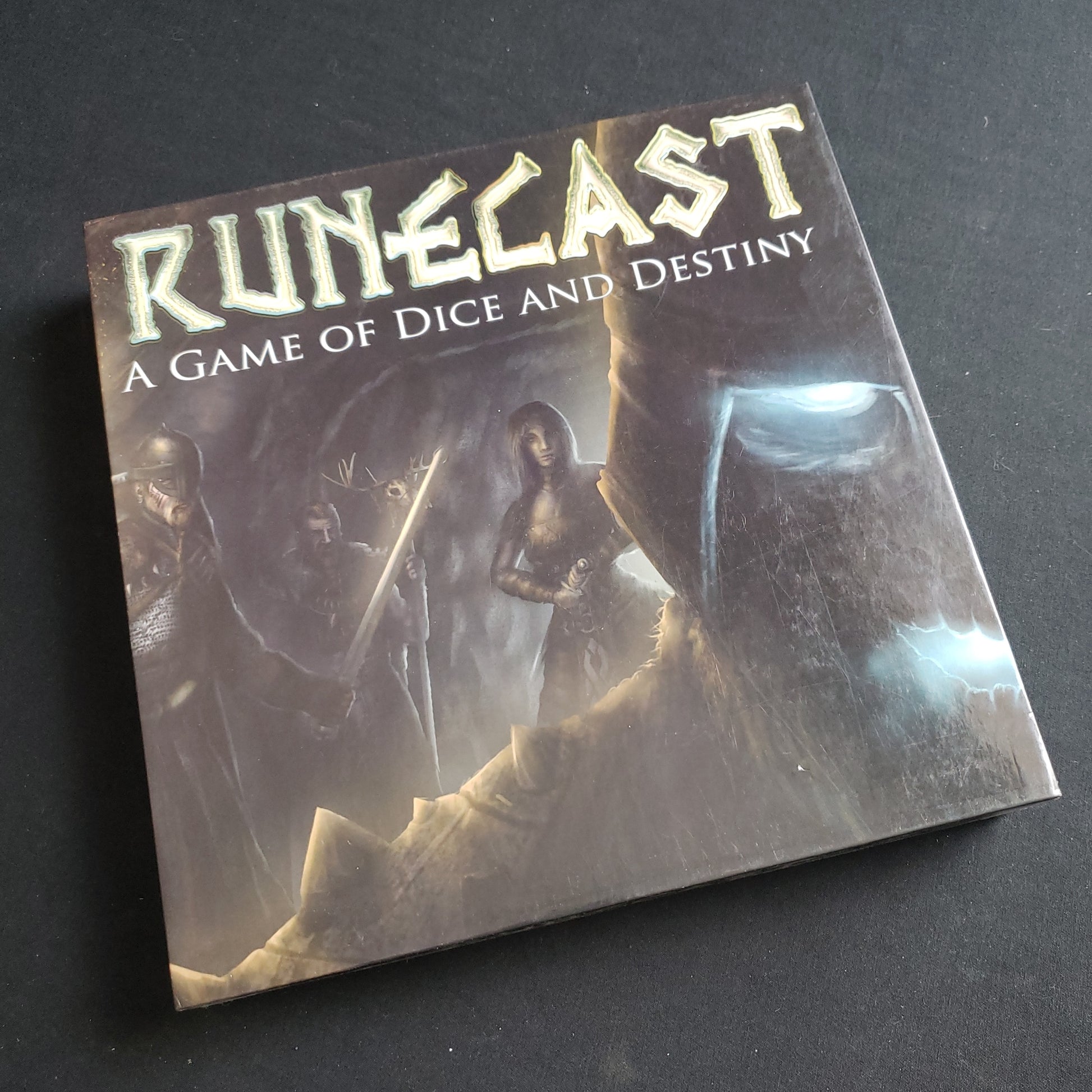 Image shows the front cover of the box of the RuneCast board game