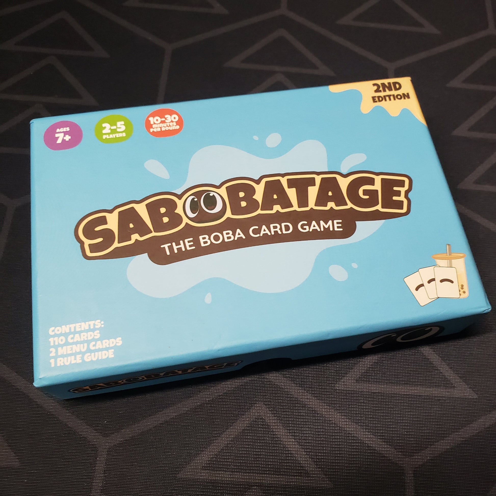 Image shows the front cover of the box of the Sabobatage card game