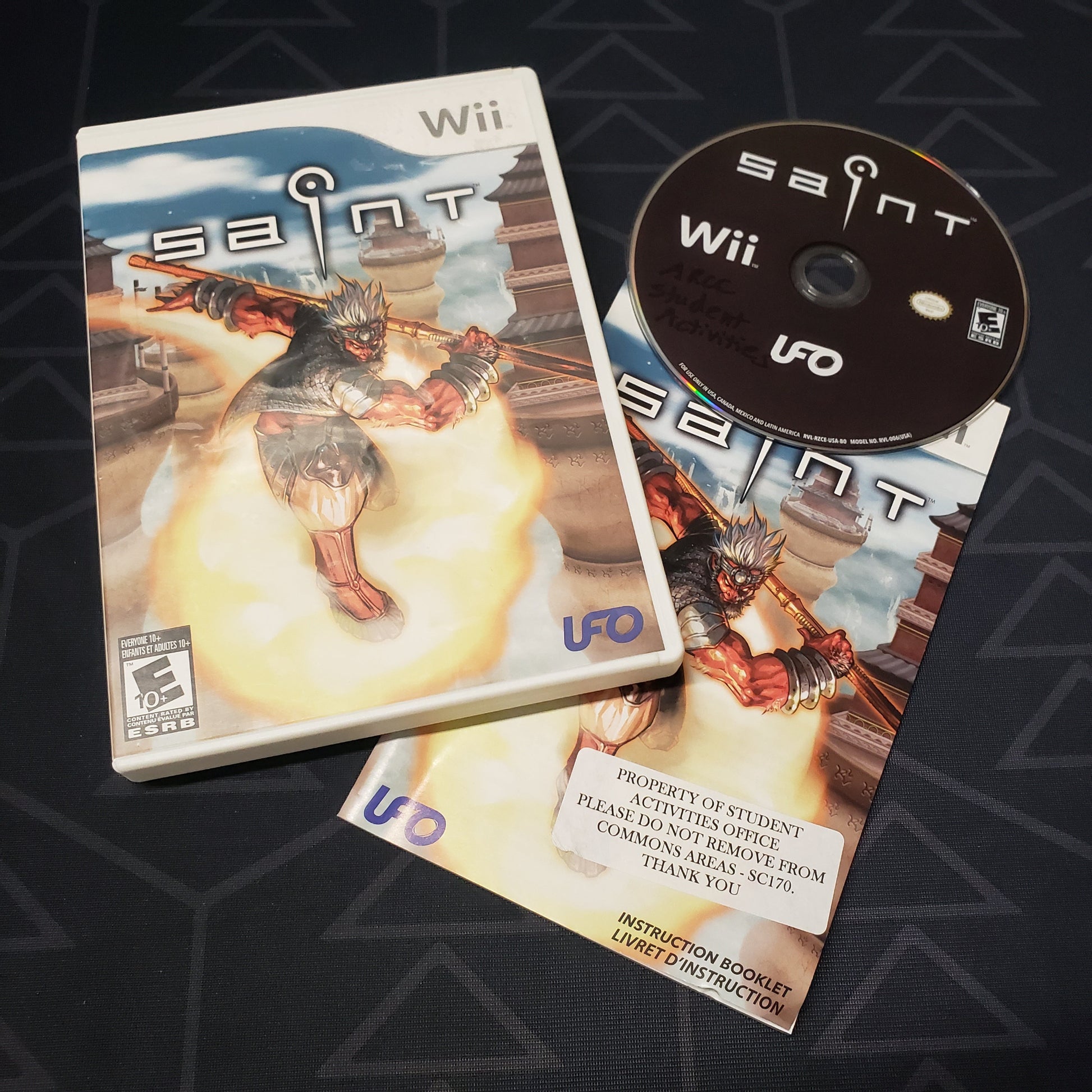Image shows the case, manual and disc for the video game Saint for Nintendo Wii