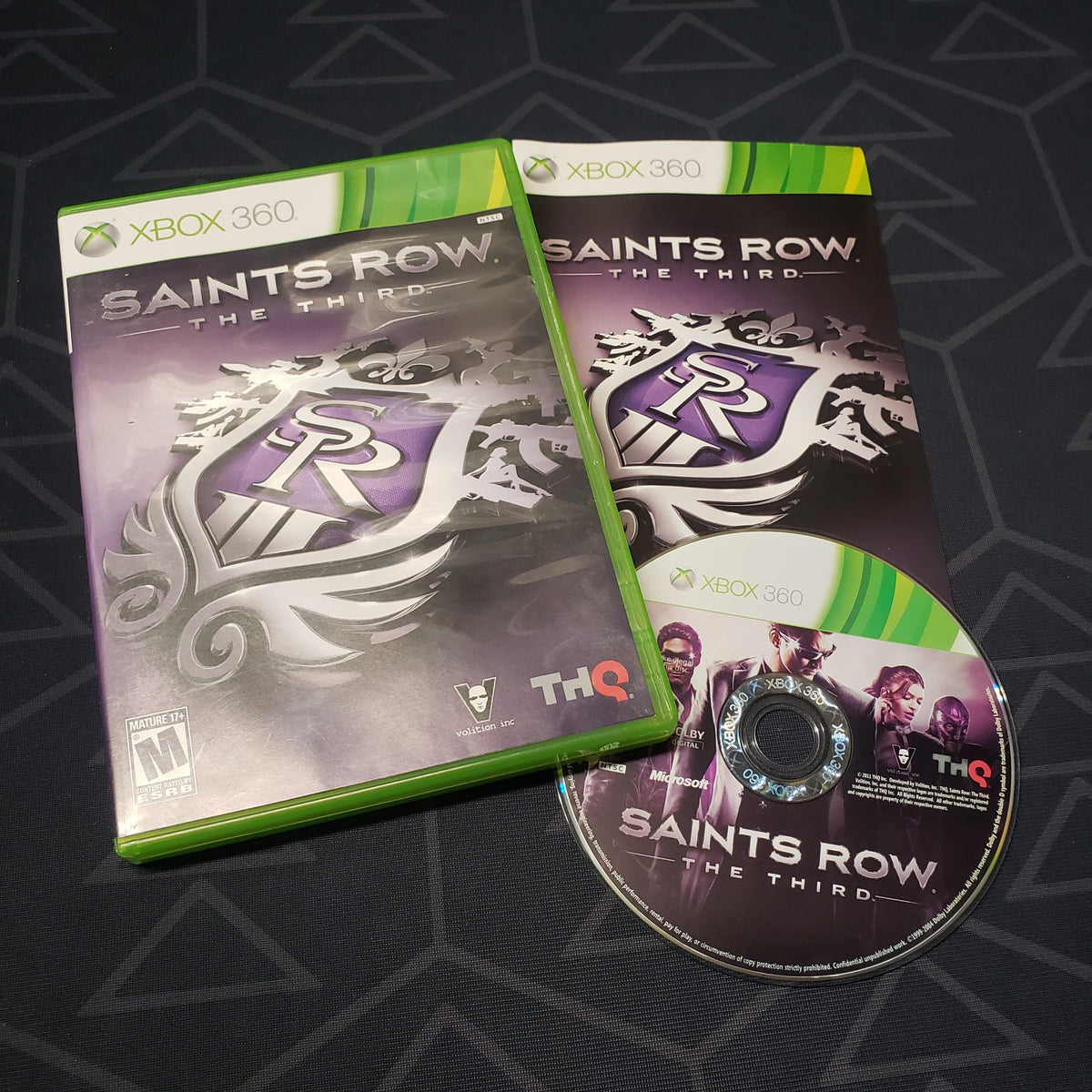 Image shows the case, manual and disc for the video game Saints Row: The Third for Xbox 360