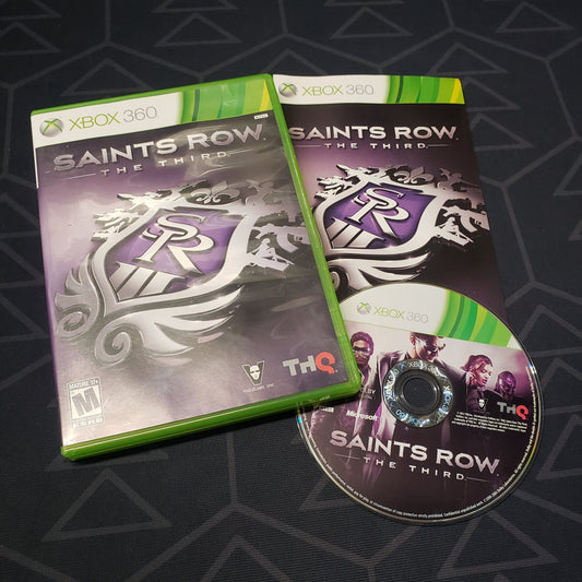 Image shows the case, manual and disc for the video game Saints Row: The Third for Xbox 360