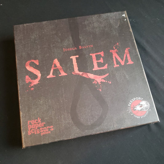 Image shows the front cover of the box of the Salem board game