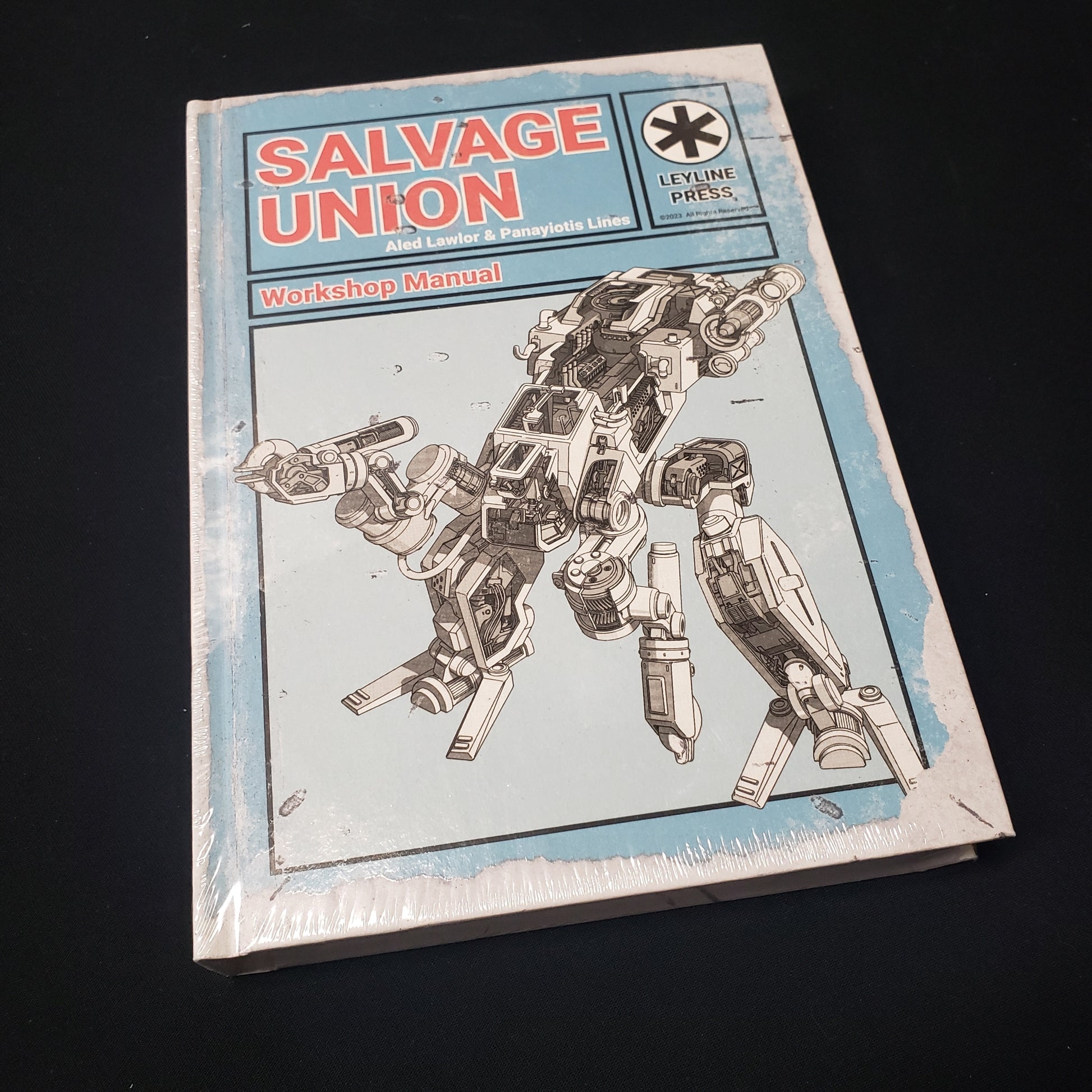 Image shows the front cover of the Workshop Manual book for the Salvage Union roleplaying game
