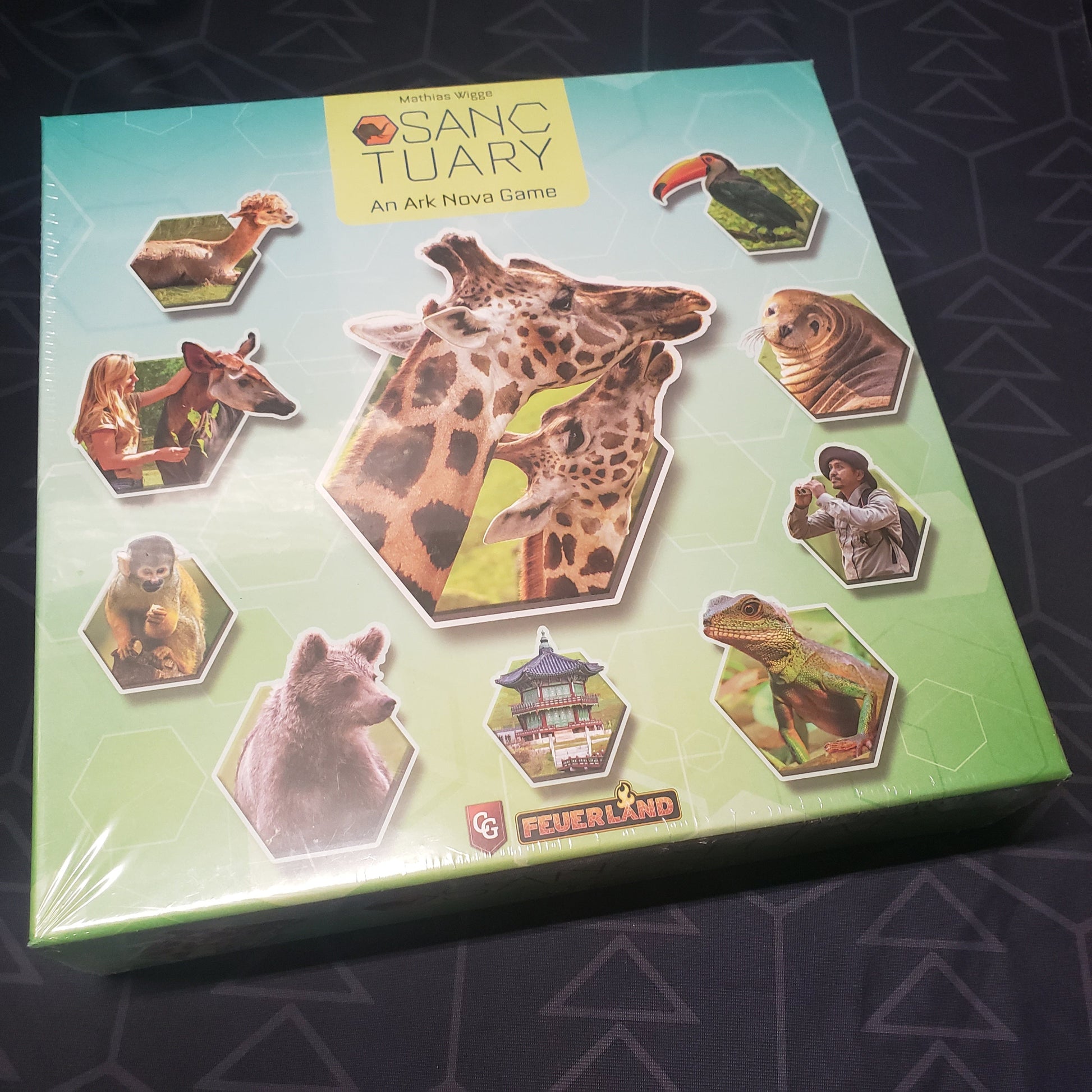 Image shows the front cover of the box for the board game Sanctuary: An Ark Nova Game