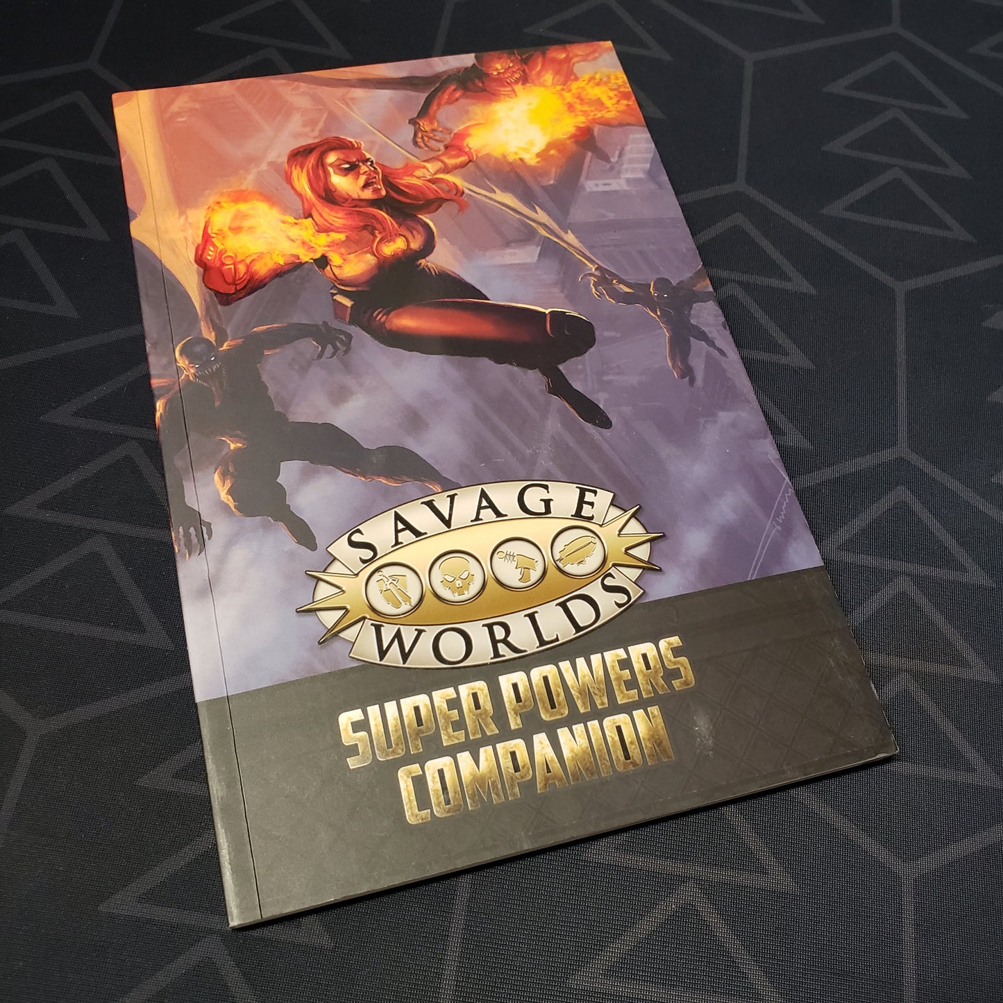 Image shows the front cover of the Super Powers Companion book for the roleplaying game Savage Worlds Deluxe