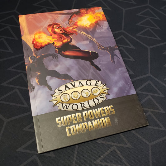 Image shows the front cover of the Super Powers Companion book for the roleplaying game Savage Worlds Deluxe