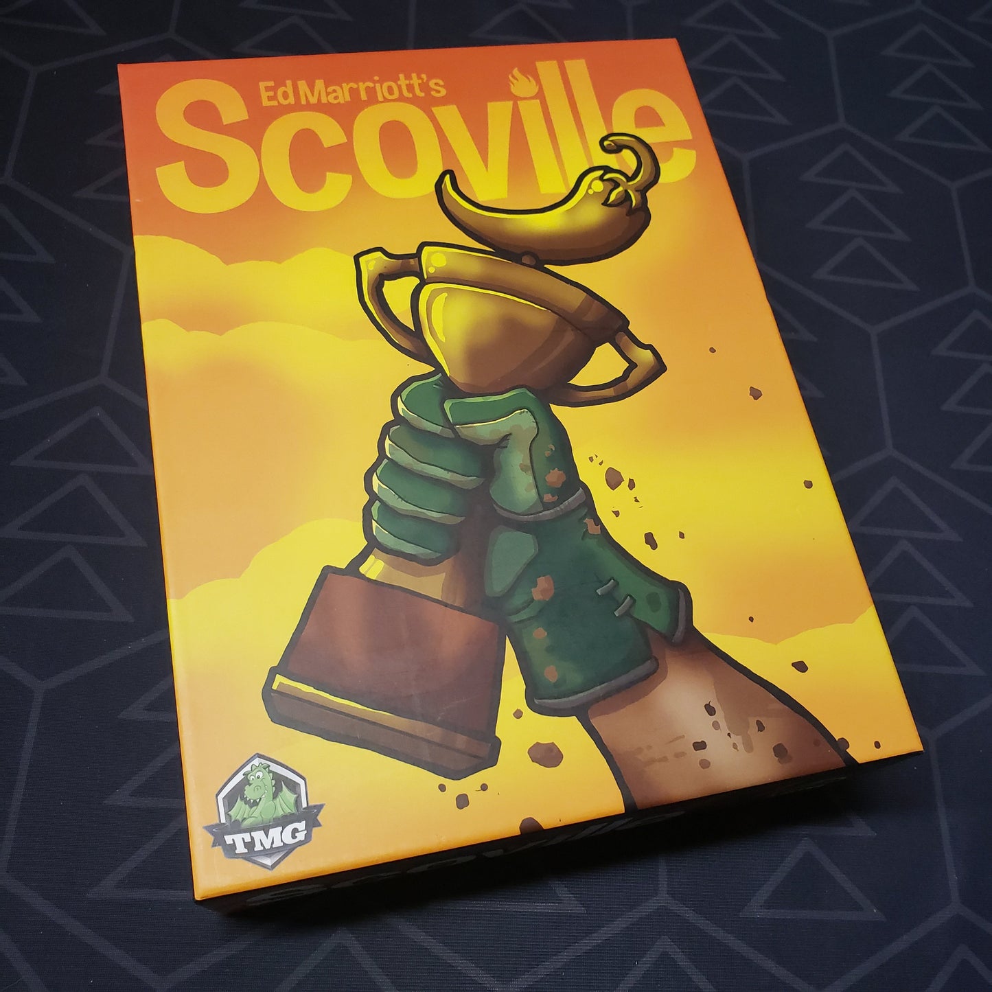 Image shows the front cover of the box for the Scoville board game