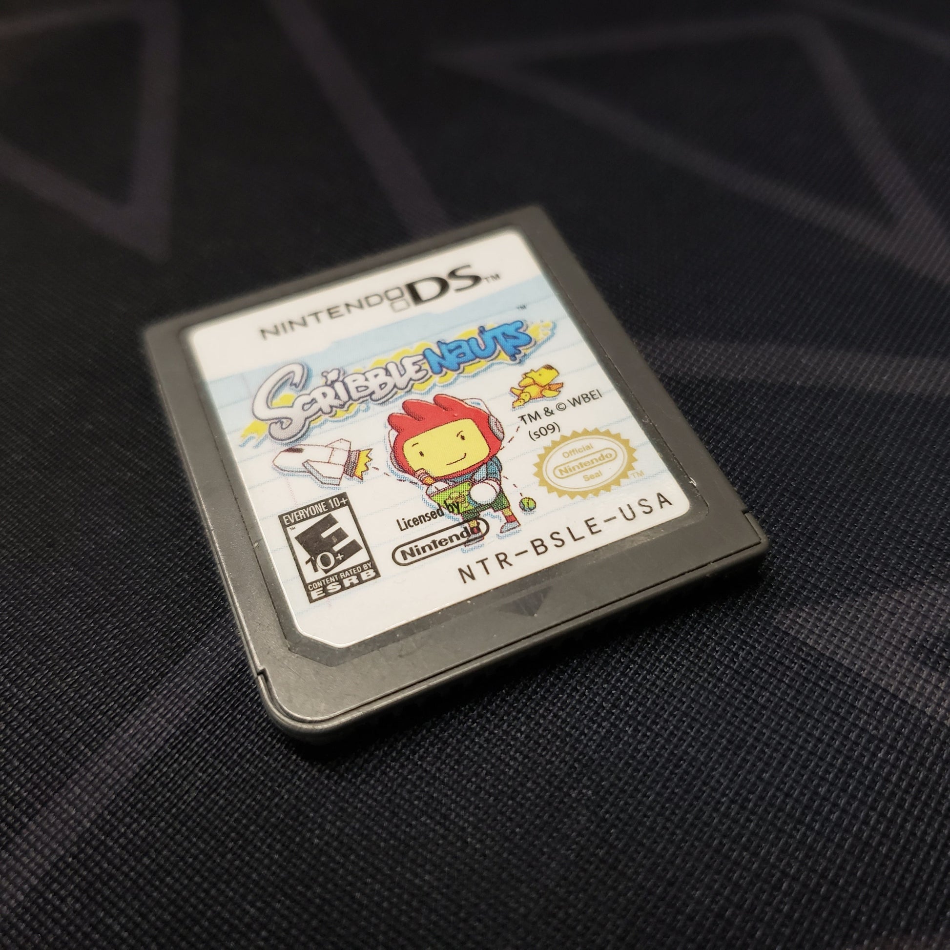 Image shows the front of the cartridge for the video game Scribblenauts for Nintendo DS